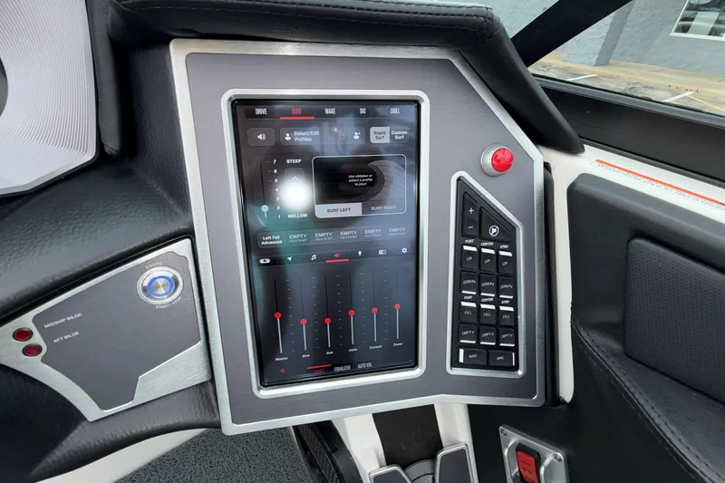 Slide: The Image of 2024 MasterCraft XT25 boat dashboard with touchscreen controls and advanced navigation system. - 15