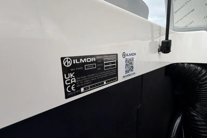 Slide: The Image of 2024 MasterCraft XT25 engine label with Ilmor specifications and QR code. - 26