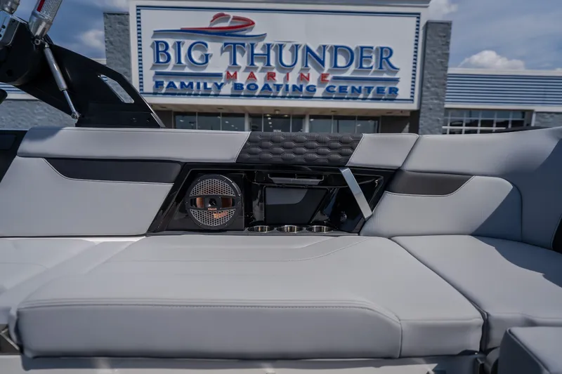 Slide: The Image of 2024 MasterCraft XT25 boat interior at Big Thunder Marine dealership. - 18