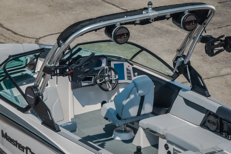 Slide: The Image of 2024 MasterCraft XT25 boat interior with advanced dashboard and seating. - 25