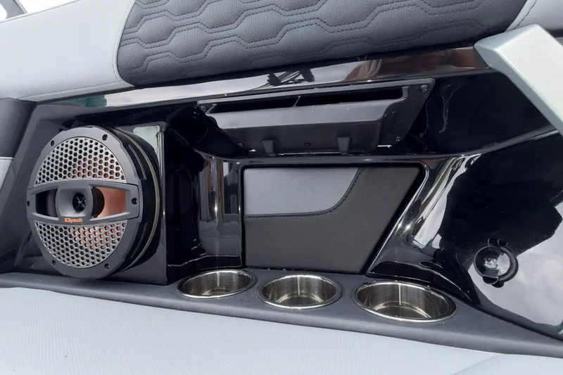 Slide: The Image of 2024 MasterCraft XT25 interior with Klipsch speaker and cup holders. - 19