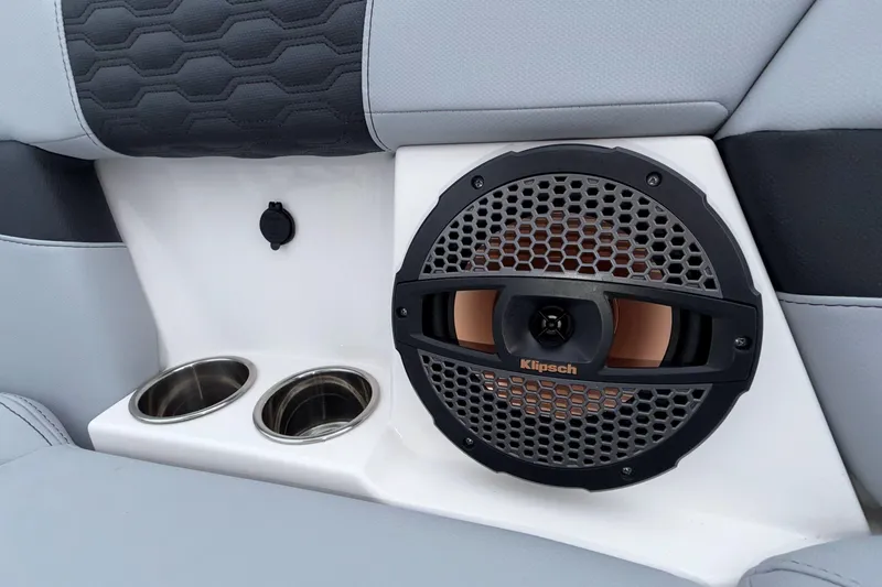 Slide: The Image of 2024 MasterCraft XT25 interior with Klipsch speaker and dual cup holders. - 5