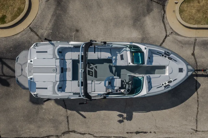 Slide: The Image of 2024 MasterCraft XT25 boat, aerial view showcasing spacious seating and sleek design. - 21