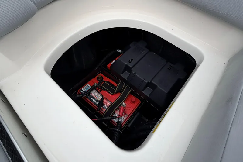 Slide: The Image of Battery compartment of 2024 MasterCraft XT25 boat, showcasing dual batteries. - 25
