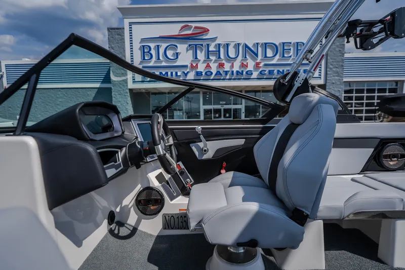 Slide: The Image of 2024 MasterCraft XT25 boat interior at Big Thunder Marine dealership. - 19