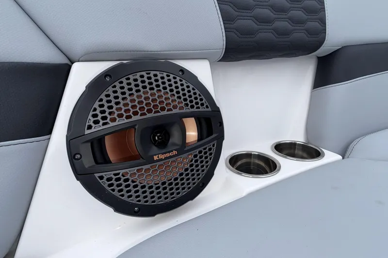 Slide: The Image of 2024 MasterCraft XT25 interior with Klipsch speaker and dual cup holders. - 4