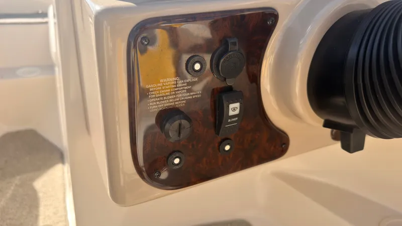 Slide: The Image of Close-up of a boat panel with switches and warning labels. - 20
