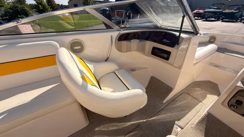 Slide: The Image of Interior view of a 2002 Rinker 192 Captiva Bowrider with white and yellow seating. - 26