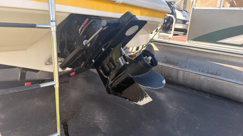 Slide: The Image of Close-up of the drive of a 2002 Rinker 192 Captiva Bowrider, on a trailer. - 4