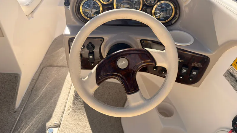 Slide: The Image of The image shows the steering wheel of a 2002 Rinker 192 Captiva Bowrider with instrument display. - 19