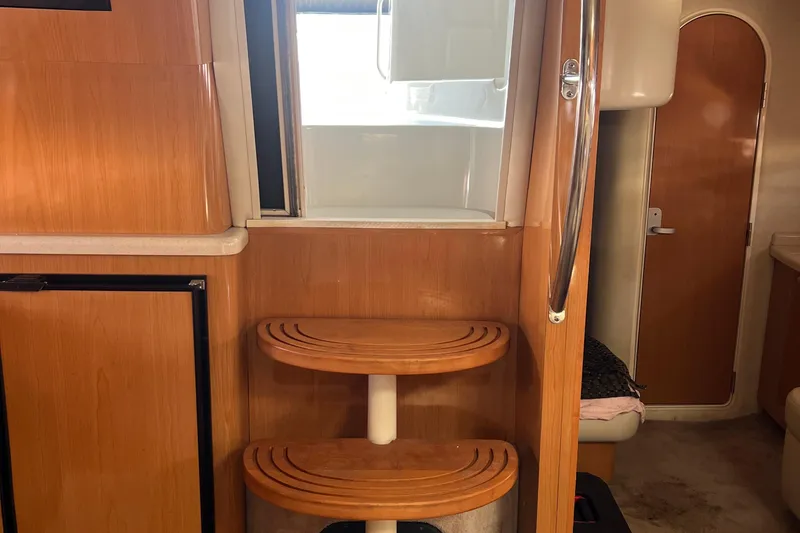 Slide: The Image of Interior of 2000 Regal Commodore 4160 yacht with wooden steps and modern design. - 18