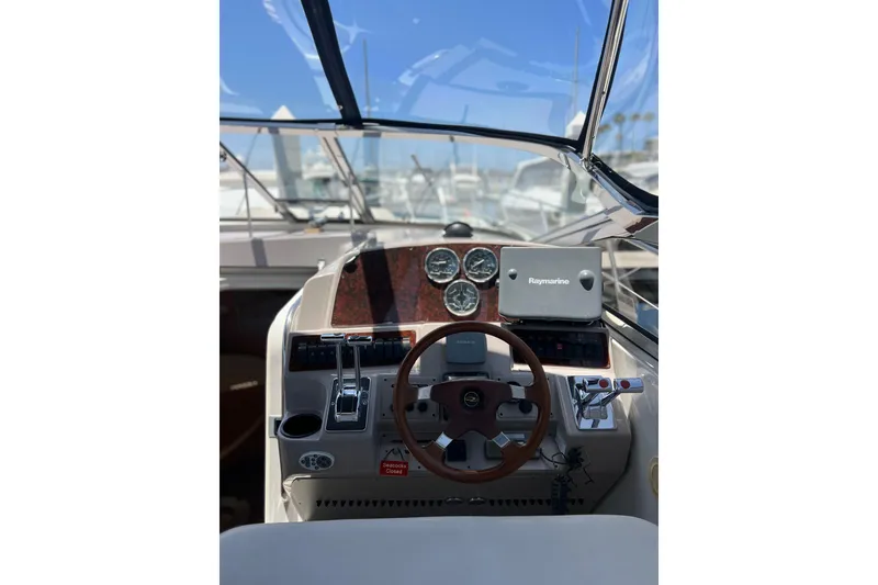 Slide: The Image of Helm of 2000 Regal Commodore 4160 with steering wheel and navigation instruments. - 9