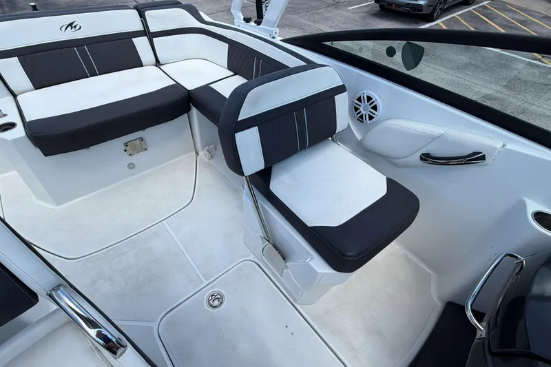 Slide: The Image of 2024 Monterey M4 boat interior with black and white seating and speaker. - 27