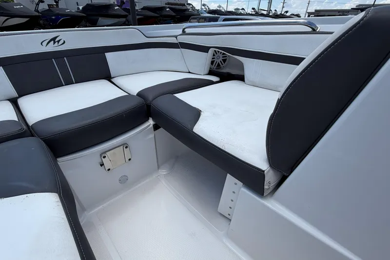 Slide: The Image of 2024 Monterey M4 boat interior with black and white seating, showcasing modern design. - 22