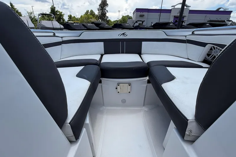 Slide: The Image of 2024 Monterey M4 boat interior with sleek black and white seating design. - 21
