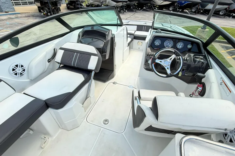 Slide: The Image of 2024 Monterey M4 boat interior with modern dashboard and seating arrangement. - 10