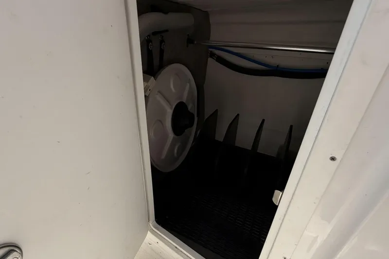 Slide: The Image of Storage compartment in a 2024 Monterey M4 boat, featuring organized interior space. - 18