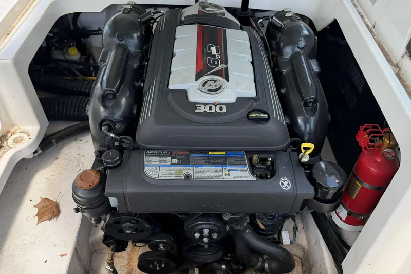 Slide: The Image of Engine compartment of a 2024 Monterey M4 boat featuring a Mercury 6.2L 300 HP engine. - 4