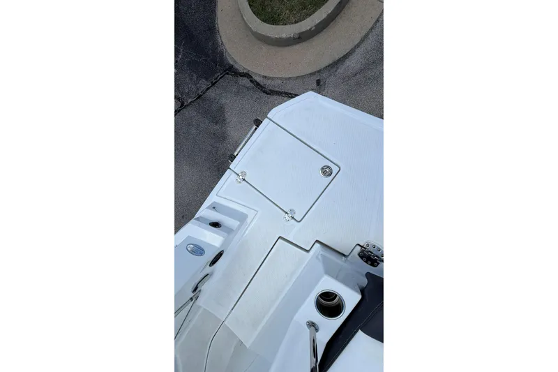 Slide: The Image of 2024 Monterey M4 boat deck with storage compartment and cup holder. - 32