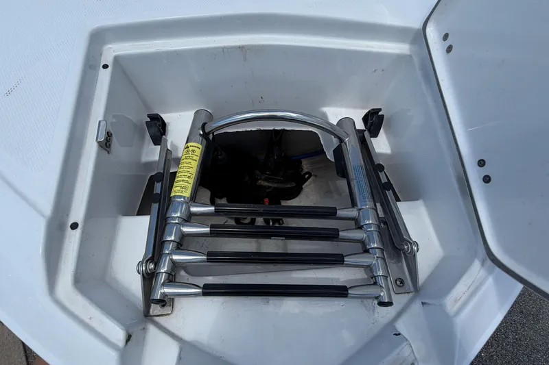 Slide: The Image of 2024 Monterey M4 boat ladder compartment with stainless steel retractable ladder. - 35