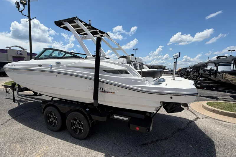 Slide: The Image of 2024 Monterey M4 boat on trailer under clear blue sky. - 40