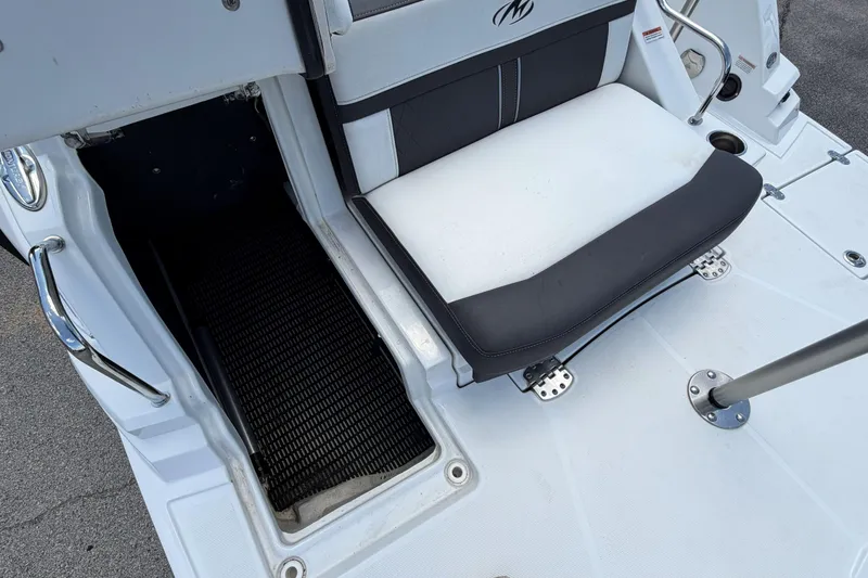 Slide: The Image of 2024 Monterey M4 boat seating area with storage compartment and sleek design. - 7