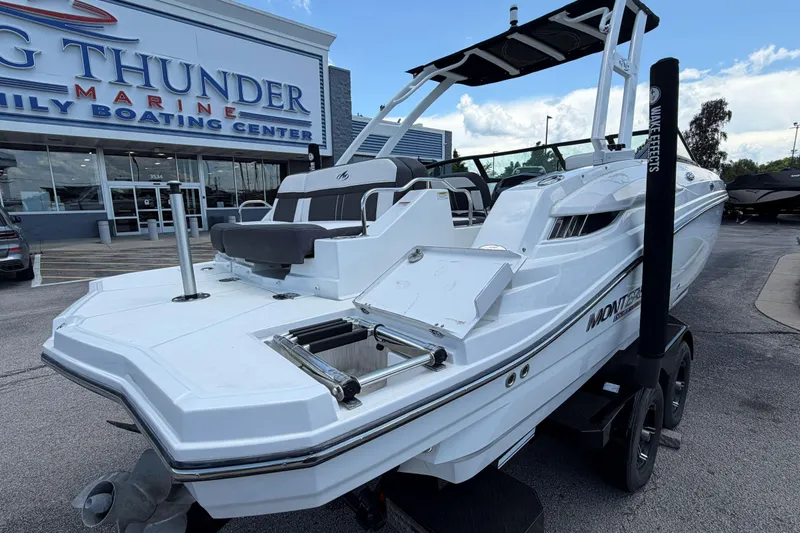Slide: The Image of 2024 Monterey M4 boat displayed at Big Thunder Marine dealership. - 33