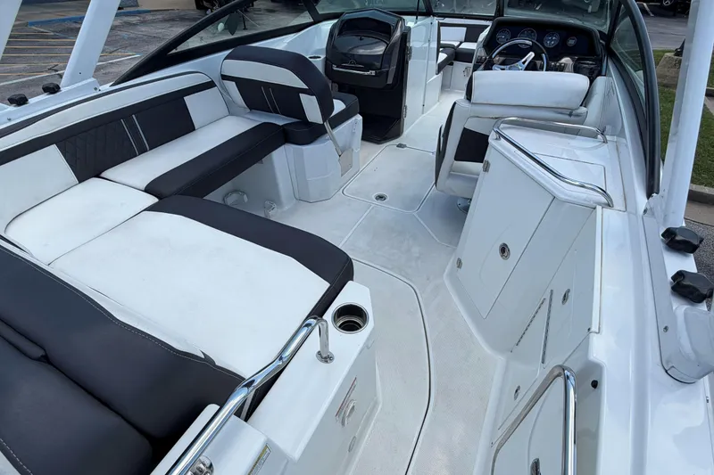 Slide: The Image of 2024 Monterey M4 boat interior with sleek white and black seating, modern dashboard, and spacious layout. - 30