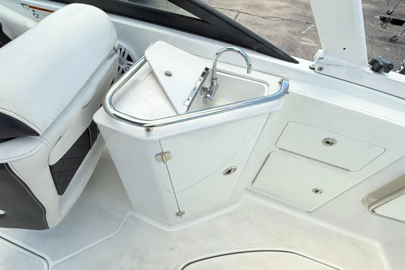 Slide: The Image of 2024 Monterey M4 boat interior with sink and storage compartments. - 11