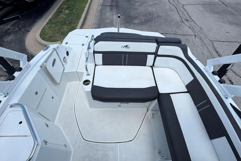 Slide: The Image of 2024 Monterey M4 boat interior with sleek seating and storage compartments. - 29
