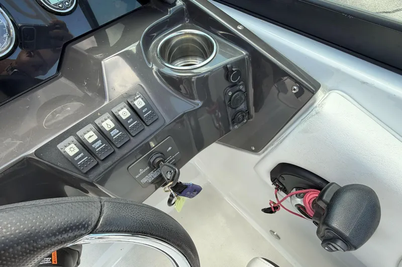 Slide: The Image of Dashboard of a 2024 Monterey M4 boat with controls and steering wheel. - 13