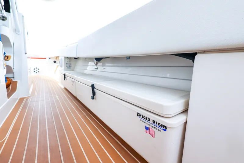 Slide: The Image of Interior view of 2018 HCB 53 Suenos boat with wooden flooring and storage compartments. - 57