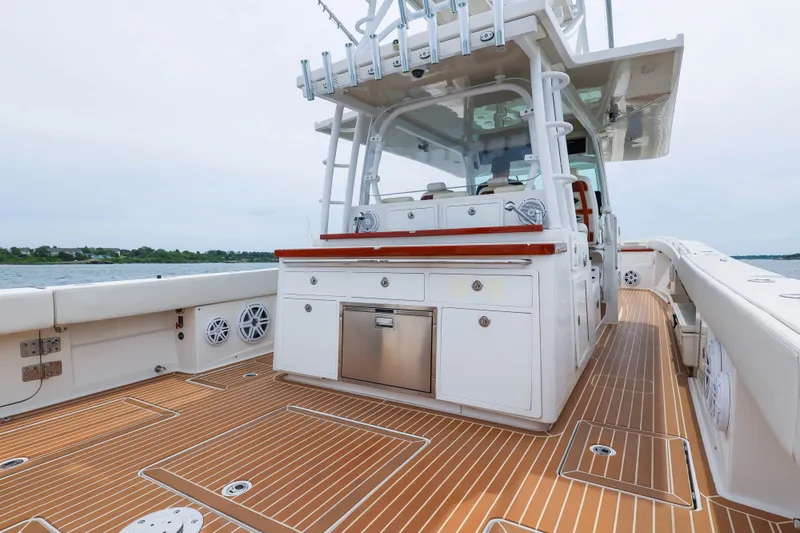 Slide: The Image of 2018 HCB 53 Suenos boat deck with sleek cabinetry and wood flooring. - 18
