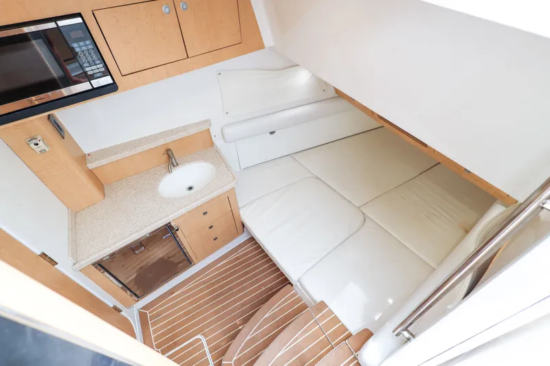 Slide: The Image of Interior of 2018 HCB 53 Suenos boat with kitchenette and sleeping area. - 41