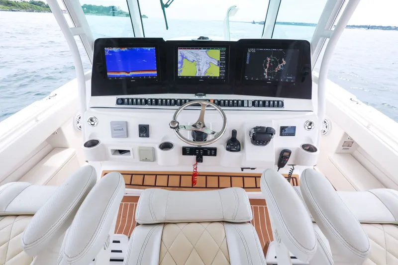 Slide: The Image of Helm of 2018 HCB 53 Suenos boat with advanced navigation displays and controls. - 28