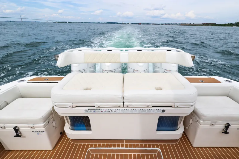 Slide: The Image of 2018 HCB 53 Suenos boat interior with cushioned seating and ocean view. - 20