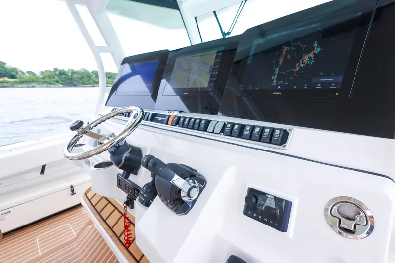 Slide: The Image of Helm of 2018 HCB 53 Suenos boat with advanced navigation displays and controls. - 26