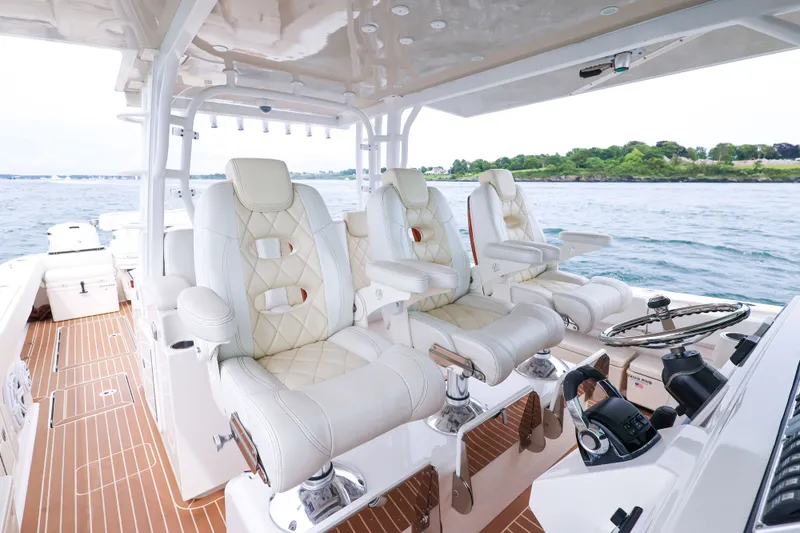 Slide: The Image of Luxurious interior of 2018 HCB 53 Suenos boat with plush seating and ocean view. - 31