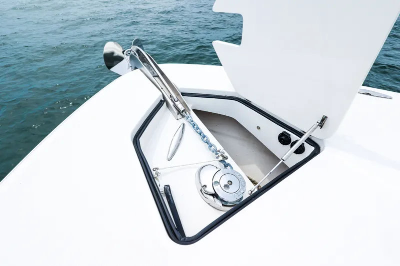 Slide: The Image of Anchor compartment of 2018 HCB 53 Suenos boat with open hatch on water. - 62