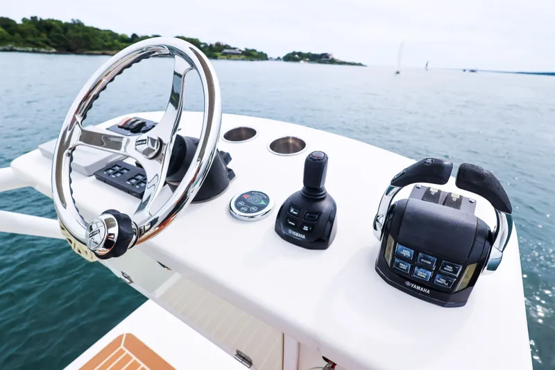 Slide: The Image of Helm of 2018 HCB 53 Suenos boat with steering wheel and controls. - 65