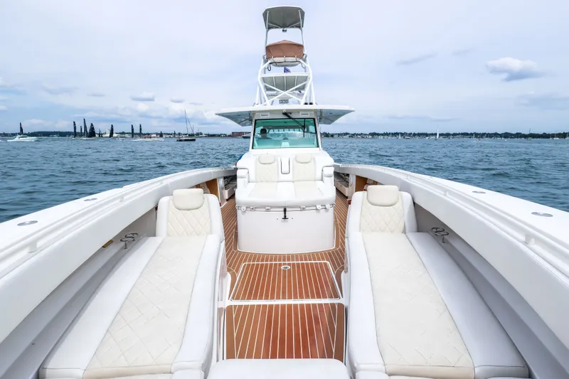 Slide: The Image of 2018 HCB 53 Suenos luxury boat with spacious deck and elegant seating on open water. - 48