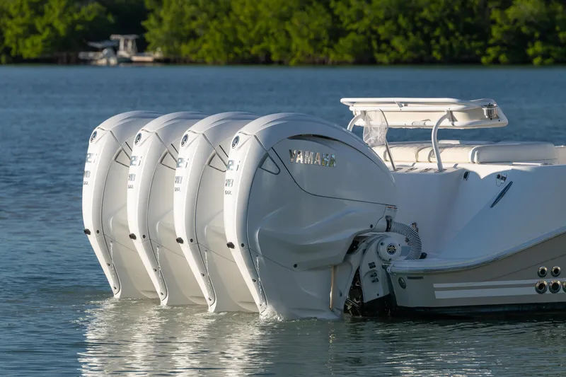 Slide: The Image of 2018 HCB 53 Suenos RXV with four Yamaha outboard engines on calm water. - 13
