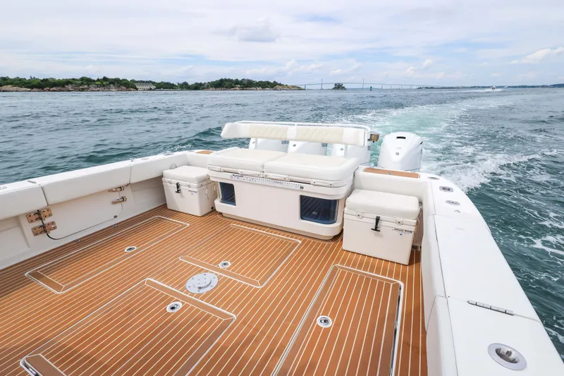 Slide: The Image of 2018 HCB 53 Suenos boat with spacious deck, cruising on open water. - 17
