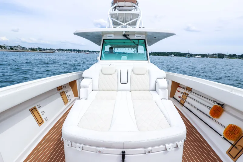 Slide: The Image of Luxurious 2018 HCB 53 Suenos boat with plush seating on open water. - 53