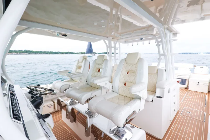 Slide: The Image of Luxurious interior of 2018 HCB 53 Suenos boat with plush seating and ocean view. - 30