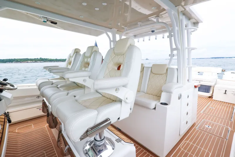 Slide: The Image of Luxurious seating on 2018 HCB 53 Suenos boat, featuring elegant white leather chairs. - 29