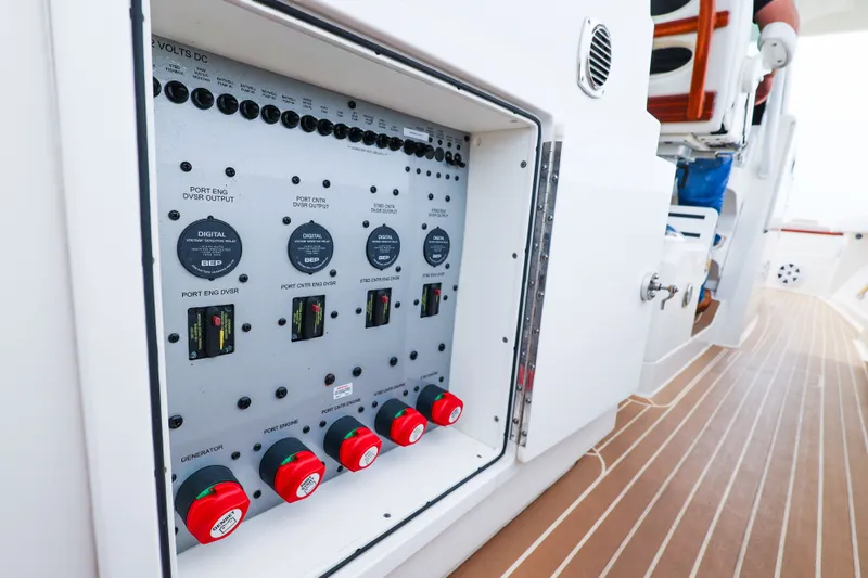 Slide: The Image of Electrical panel on 2018 HCB 53 Suenos boat, featuring control switches and gauges. - 60
