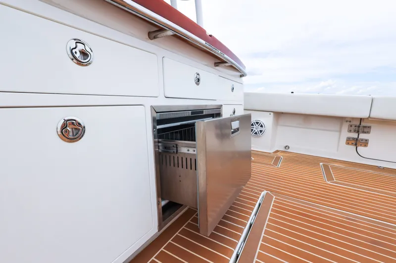Slide: The Image of 2018 HCB 53 Suenos yacht interior with open stainless steel drawer on teak deck. - 25