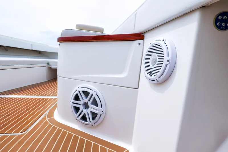 Slide: The Image of 2018 HCB 53 Suenos boat deck with speakers and teak flooring. - 61