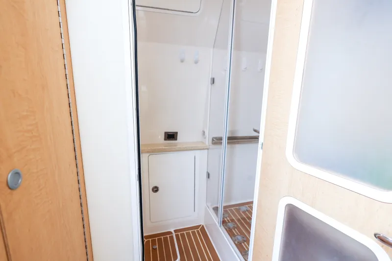 Slide: The Image of Interior of 2018 HCB 53 Suenos yacht featuring a modern shower area with wooden flooring. - 42